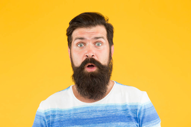 Hair care. mature hipster has perfect moustache. surprised looking guy. male barber care. get style in barbershop. bright life living. brutal bearded man on yellow background. male summer fashion - Foto, afbeelding