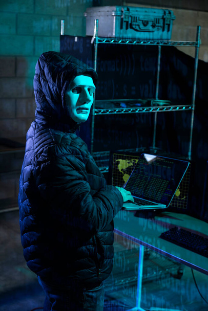 Hacker using laptop with binary code digital interface. Double exposure. Hacking and malware concept. - Фото, изображение