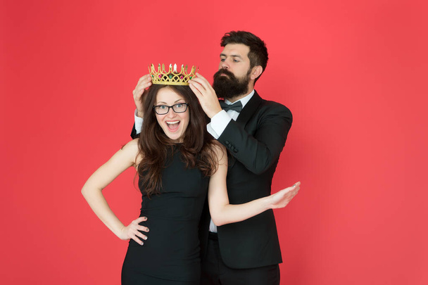 Achievement. Promotion and reward. Prom queen. Bearded man sexy girl. Royal party. Prom couple in formal style. Prom party. Holiday celebration. Pride and glory. Luxury success symbol. Party night - 写真・画像