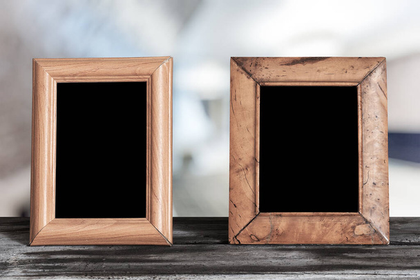 photo frames on the wooden table in the living room - Photo, Image