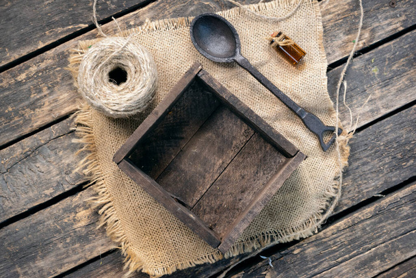 Wooden container box and spoon on old wooden table background. - Foto, Imagem