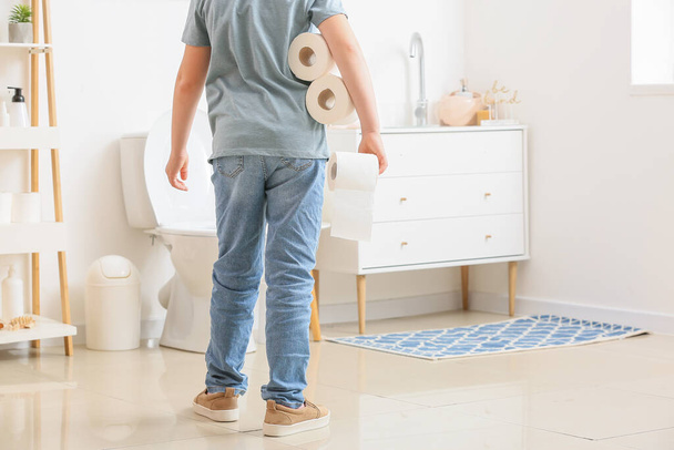Little boy with toilet paper in restroom - Photo, Image