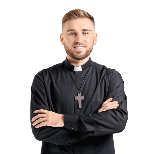 Handsome young priest on white background - Foto, Imagem