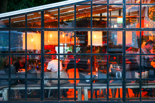 Lidkoping, Sweden  A glassed-in restaurant pavillion at night. - Zdjęcie, obraz