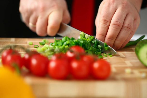 Cropped photo of professional cook preparing dinner - Foto, imagen