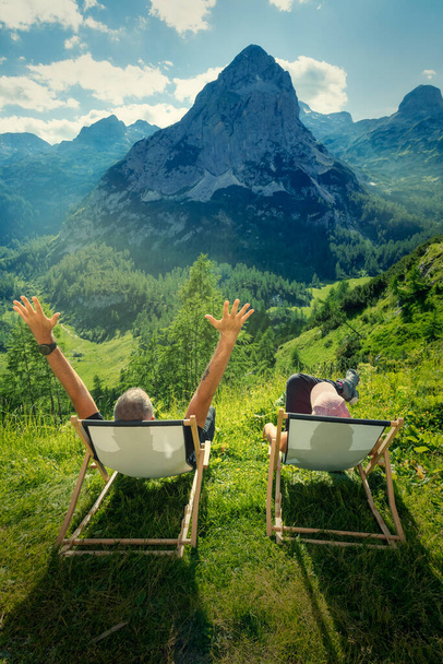 Perfect holidays for active people. Couple on a vacation between sky and earth. Resting high in the mountains. - Photo, Image