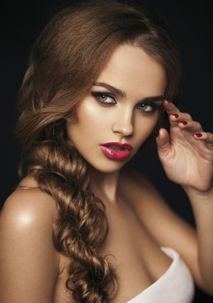 Beautiful girl with red lips. Red lipstick. Red manicure. long h - Fotó, kép