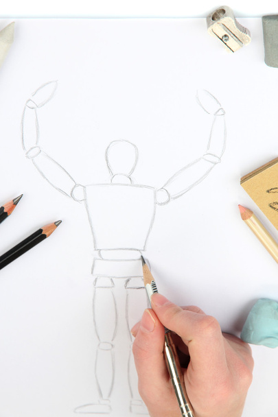 Mão desenha um esboço com materiais de arte profissional
 - Foto, Imagem