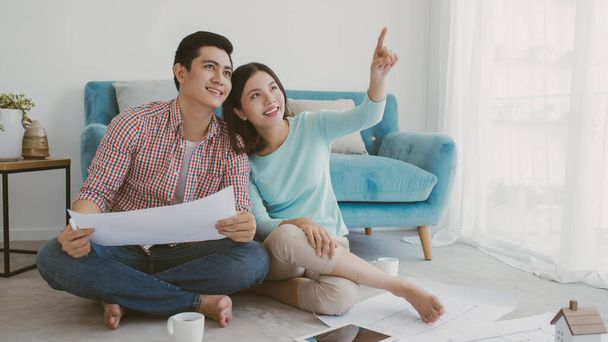Couple searching ideas to decorate new home - Photo, Image