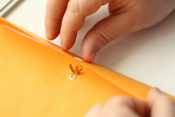 Male hands holding envelope with important information - Foto, Imagem