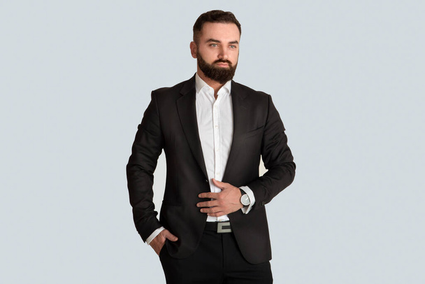 Elegant business owner in formal attire on grey background - Photo, Image