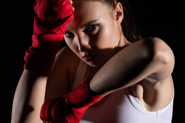 Combination of elbow punches in a sport called MMA for short. Professional player of mixed martial art. Strong woman. - Foto, afbeelding