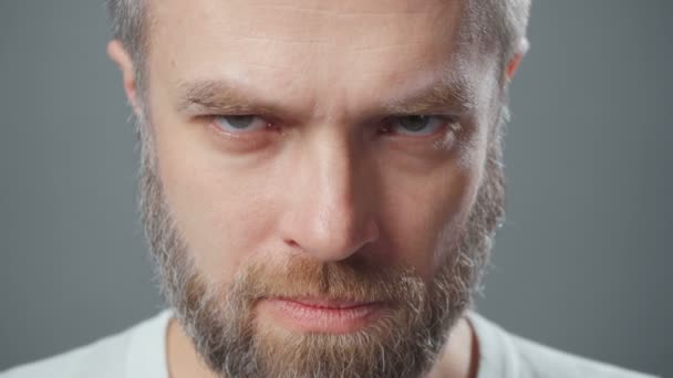 Extreme close up video of man looking frowningly - Footage, Video