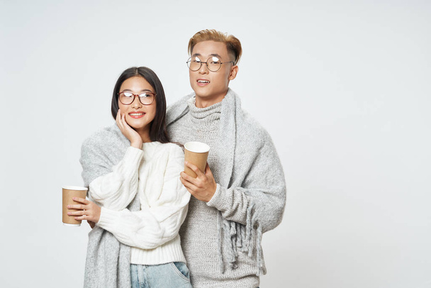 Happy man and woman in glasses and a cup of coffee - Photo, Image