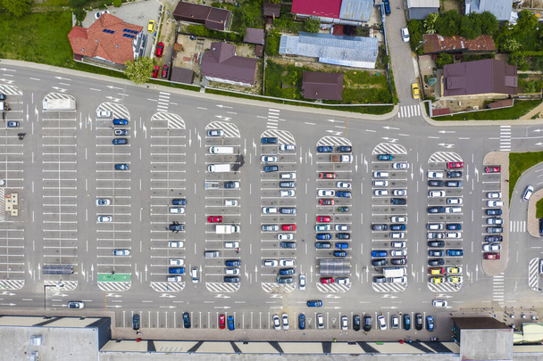 Parking lot and cars viewed from above, shopping mall parking area - Photo, Image