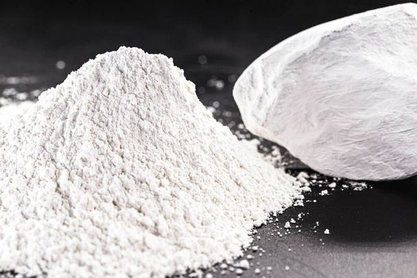 Kaolin is a mineral of inorganic constitution, chemically inert, extracted from deposits and processed in different granulometric bands. Used in the food, paper and paints industry - Photo, Image