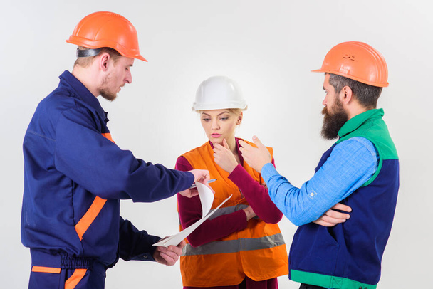 Men in hard hats, uniform and woman. Team of architects, - Photo, image
