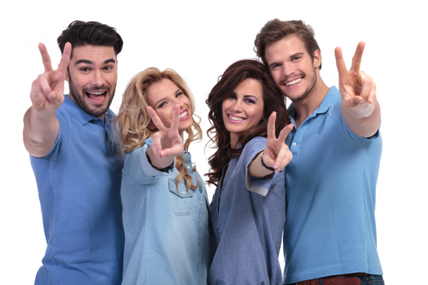 happy group of young people making the victory hand sign - Fotografie, Obrázek