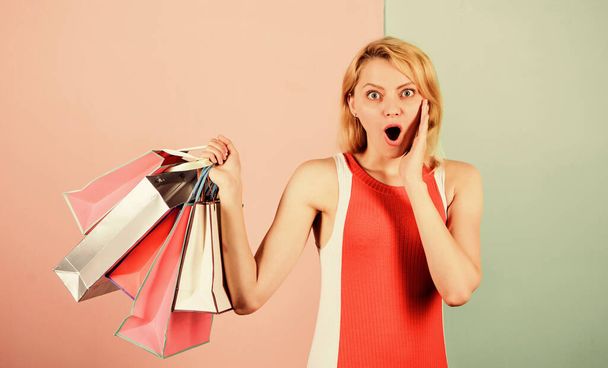 Discounts and loyalty program. Real sale. Woman on shopping tour. Retail and consumerism. Ecology impact. Satisfied with her shopping. Girl with paper bags. Black friday concept. Happy shopping day - Foto, imagen