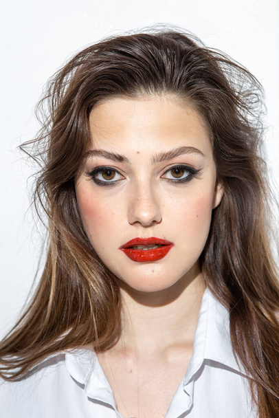 Beauty portrait of a girl with makeup with red lips - Fotoğraf, Görsel