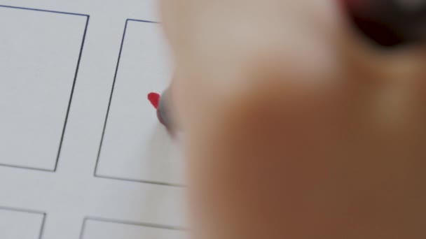 Woman draws a tick on voting blank. Close up hand writing a checkmark or vote - Footage, Video