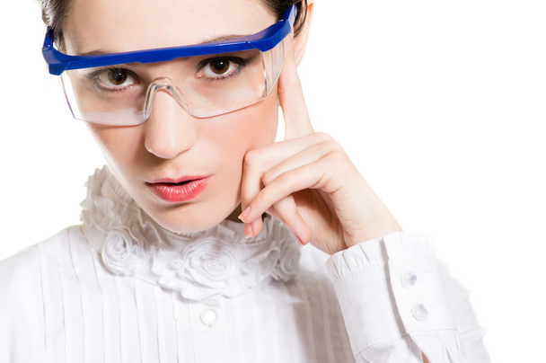 Young woman in eye shields looking thoughtful and puzzled - Foto, Imagem