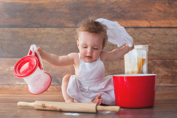 Little baby chef in apron. - Valokuva, kuva