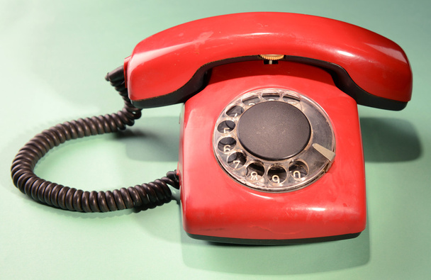 Red retro telephone,on color background - Valokuva, kuva