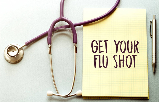 get your flu shot written on a clipboard, Medical concept - Foto, afbeelding