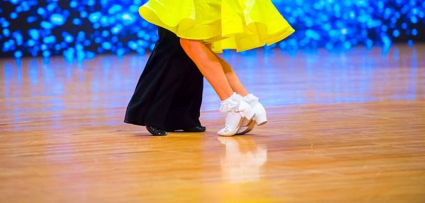 Attractive young couple of children dancing ballroom dance. Girl and boy dancer latino international dancing. - Photo, Image