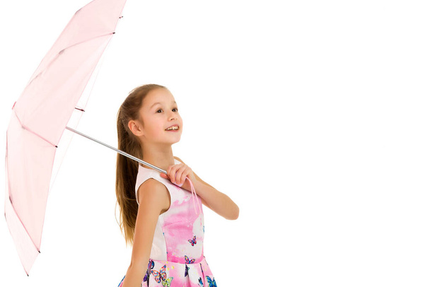 Little girl with umbrella.Concept style and fashion. Isolated on white background. - Zdjęcie, obraz