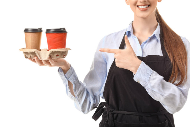Young female barista on white background - Foto, imagen
