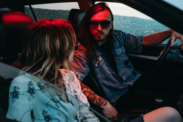 Young Stylish Traveling Hipsters Having Fun Sitting in Modern Car Travel and Road Trip Concept - Zdjęcie, obraz