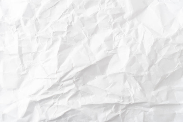 Vista superior del fondo de textura de papel blanco arrugado
. - Foto, imagen