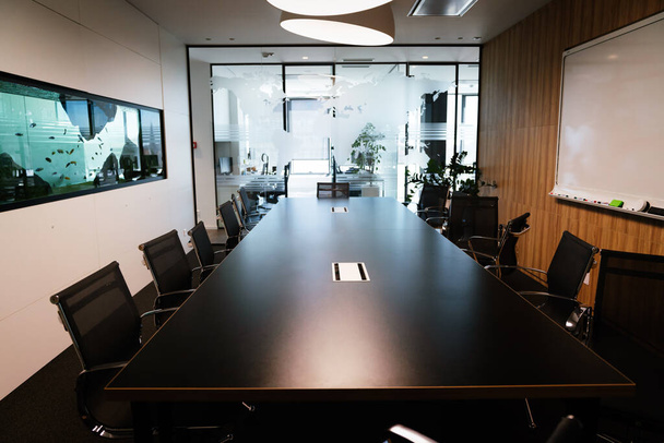 Empty conference room with board room table and chairs - Foto, afbeelding