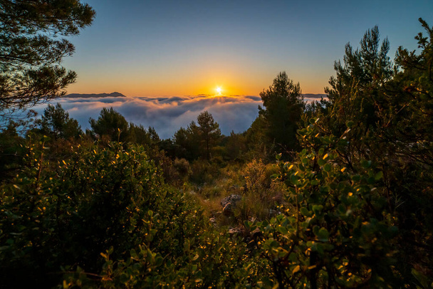 Sunrise views from the Montcabrer mountain in a day with clouds, Cocentaina, Alicante, Spanyolország. - Fotó, kép