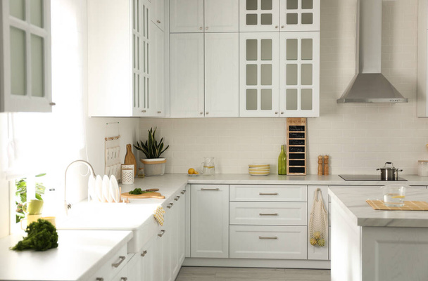 Elegant kitchen interior design with modern furniture - Fotoğraf, Görsel