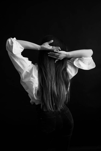 Details of body of beautiful girl, fashion and art, authentic black and white photo shoot, candid portrait of girl, movement and dance - Zdjęcie, obraz
