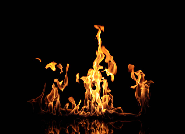 Beautiful bright fire flames on black background - Foto, Imagen