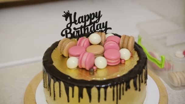 Birthday party table celebration showstopper cake decorated with candy and macarons cookies - Footage, Video