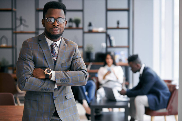Young african-american businessman in front of camera - Fotó, kép