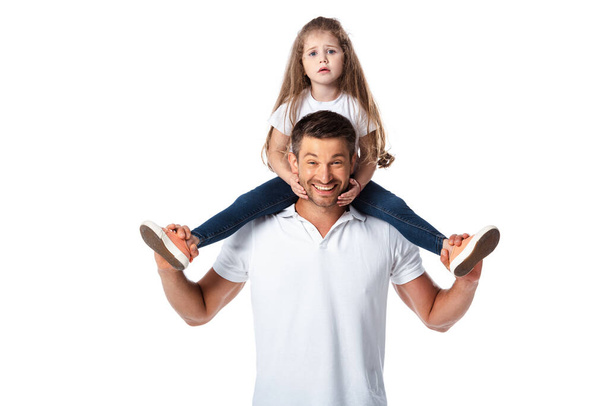 cute kid sitting on shoulders of cheerful father isolated on white  - Zdjęcie, obraz