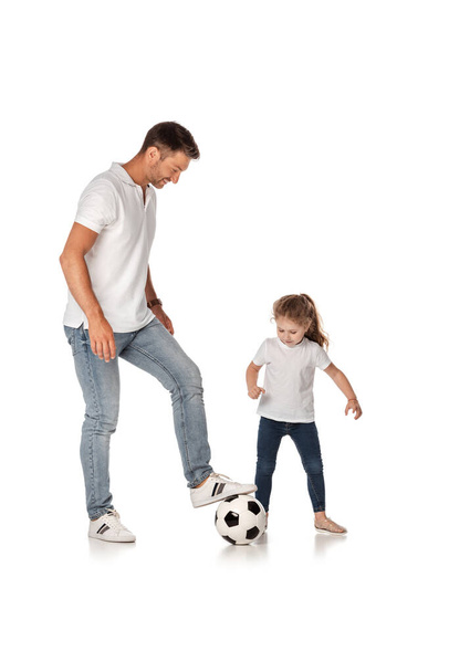 handsome father playing football with cute daughter on white  - Фото, зображення