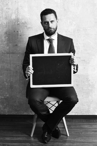 businessman or sad man holding a blackboard - 写真・画像