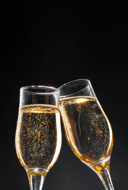 Glass full of champagne on black background - Photo, image