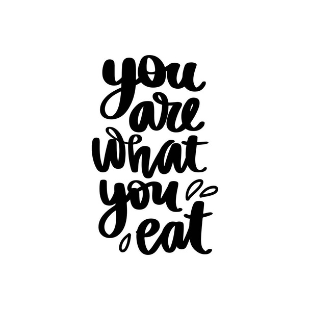You are what you eat. Vector hand drawn lettering quote about healthy food. - Вектор,изображение