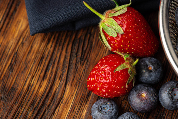 Close up photo of blueberries and strawberries - Φωτογραφία, εικόνα