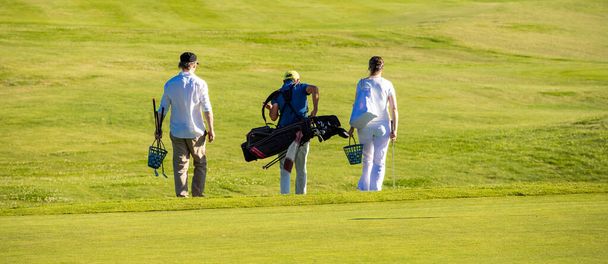 Golf players changing position on the golf course - Фото, зображення
