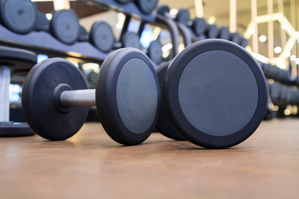 Closeup of dumbbells in gym - Photo, Image