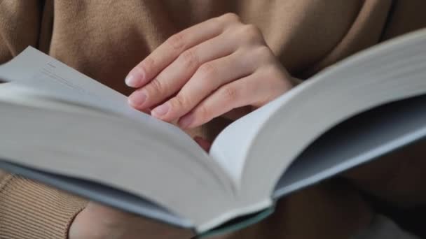 Beautiful hands young model turning pages of the book - Footage, Video